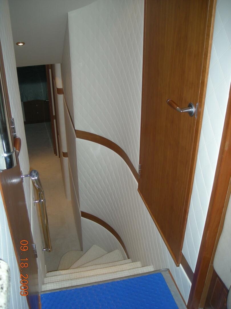 a wooden door with a railing aboard LIVNWEL Yacht for Sale