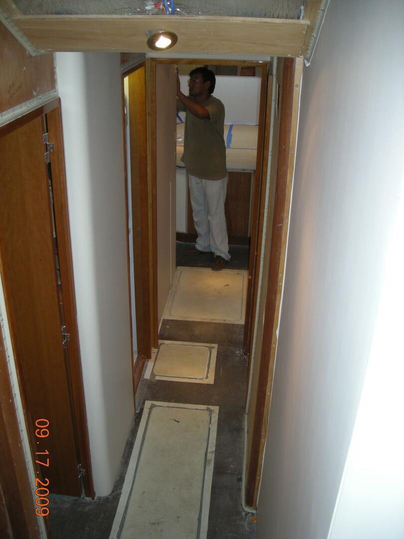 a person standing in a doorway aboard LIVNWEL Yacht for Sale
