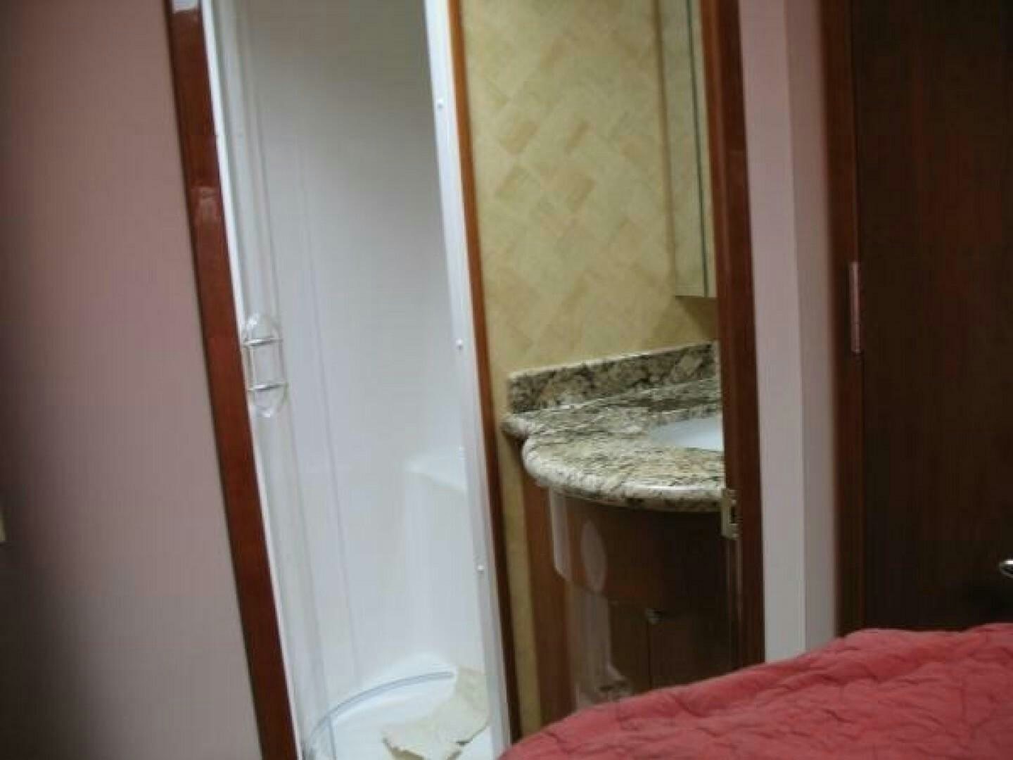 a bathroom with a mirror aboard LIVNWEL Yacht for Sale