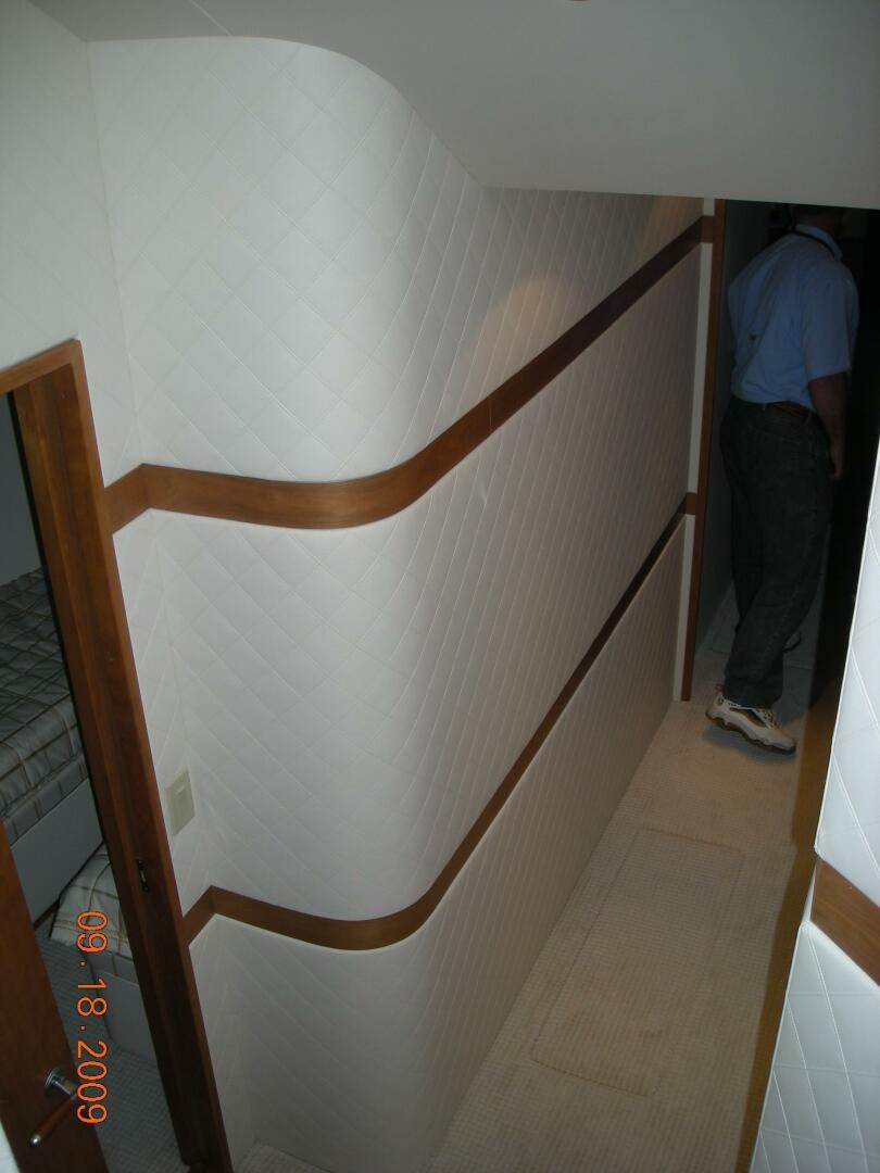 a wooden bunk bed aboard LIVNWEL Yacht for Sale