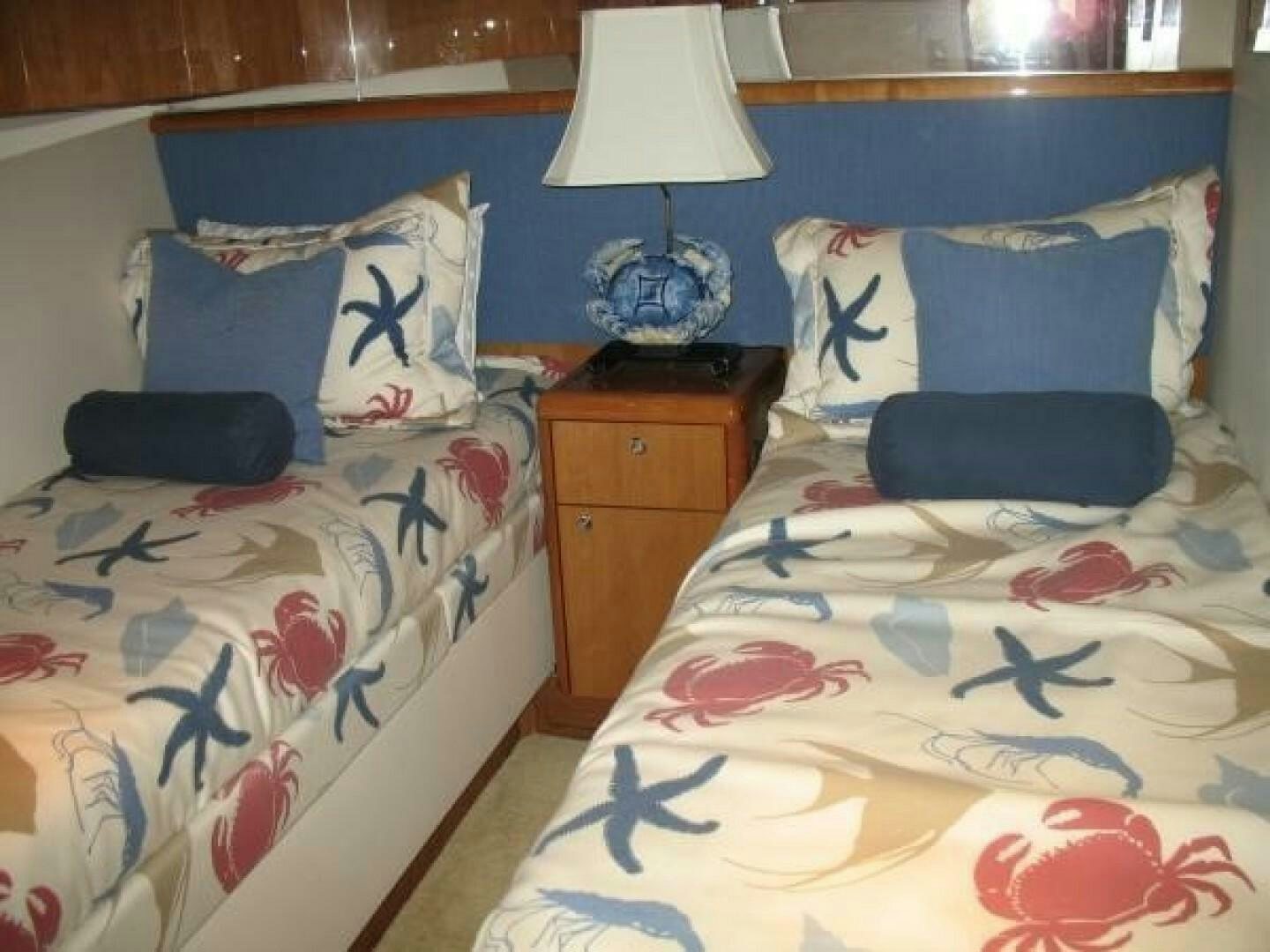 a couple of beds in a room aboard LIVNWEL Yacht for Sale