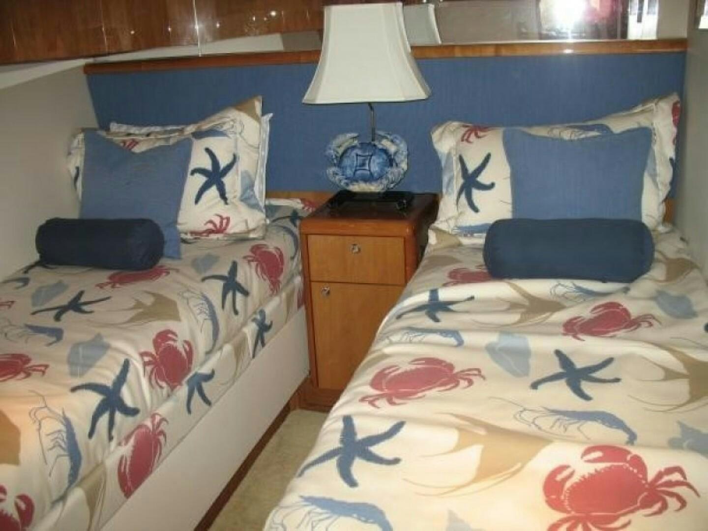 a couple of beds in a room aboard LIVNWEL Yacht for Sale
