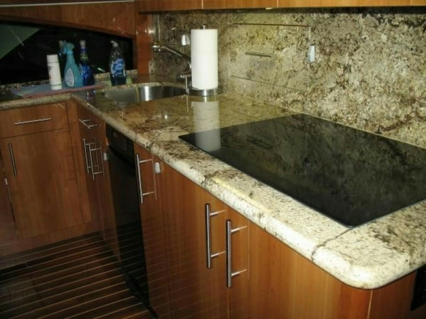 a kitchen with a sink and countertop aboard LIVNWEL Yacht for Sale