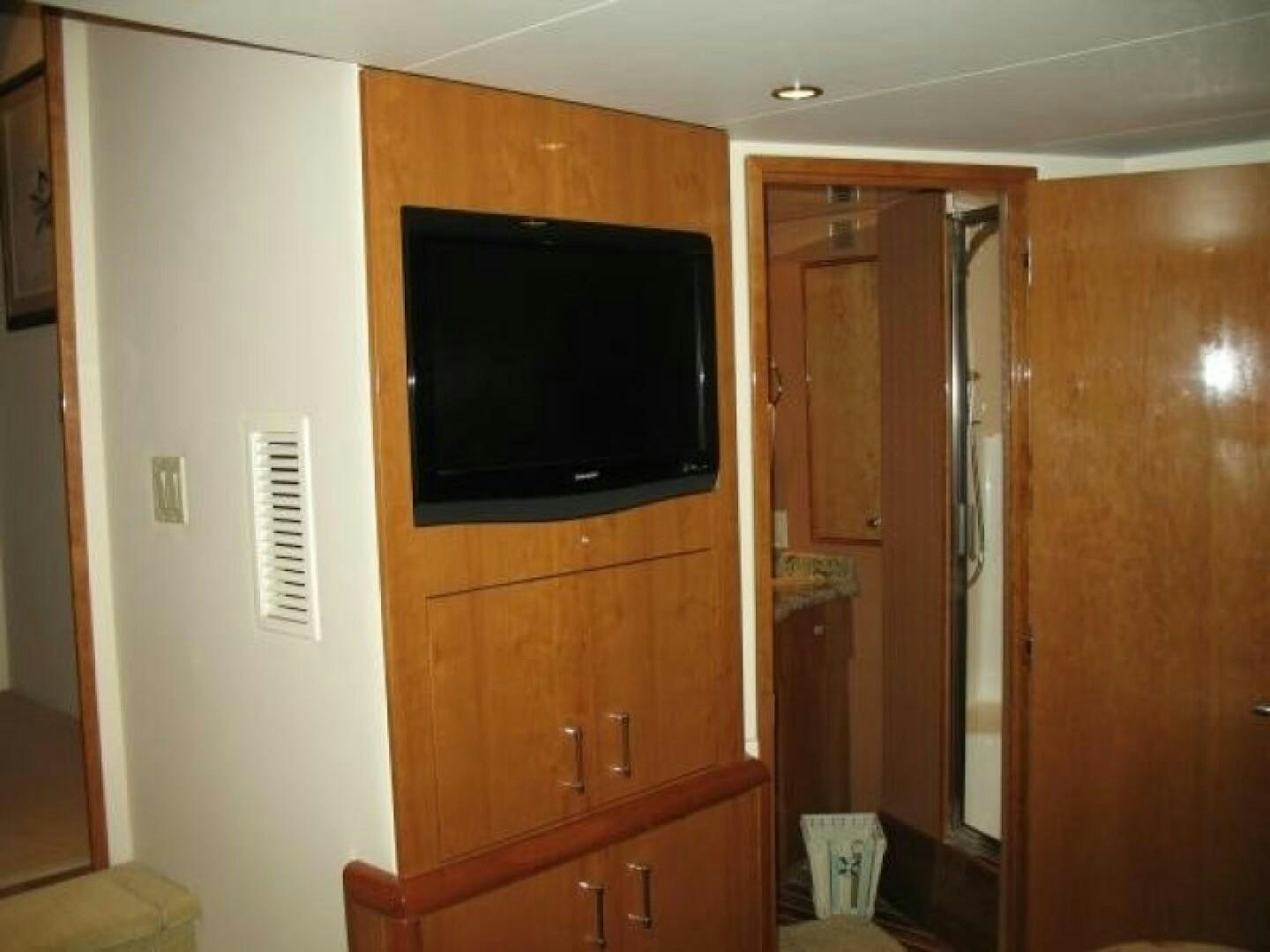 a tv on a cabinet aboard LIVNWEL Yacht for Sale