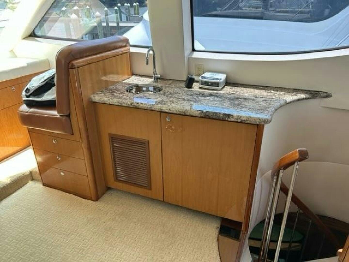 a kitchen with a sink and a countertop aboard LIVNWEL Yacht for Sale