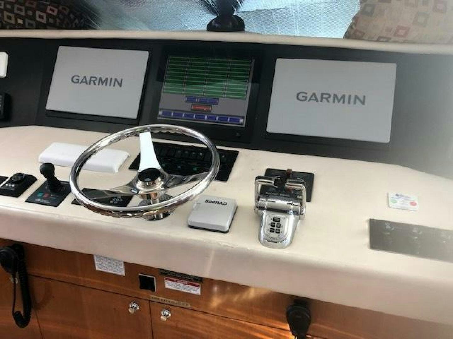 a white computer with a white and black display on a white surface aboard LIVNWEL Yacht for Sale