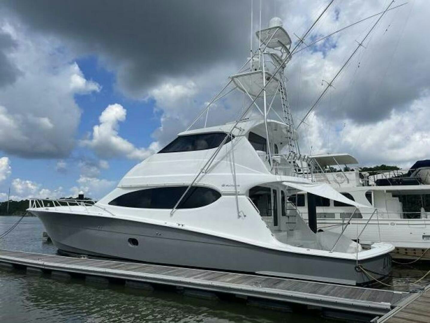 a white yacht on the water aboard LIVNWEL Yacht for Sale