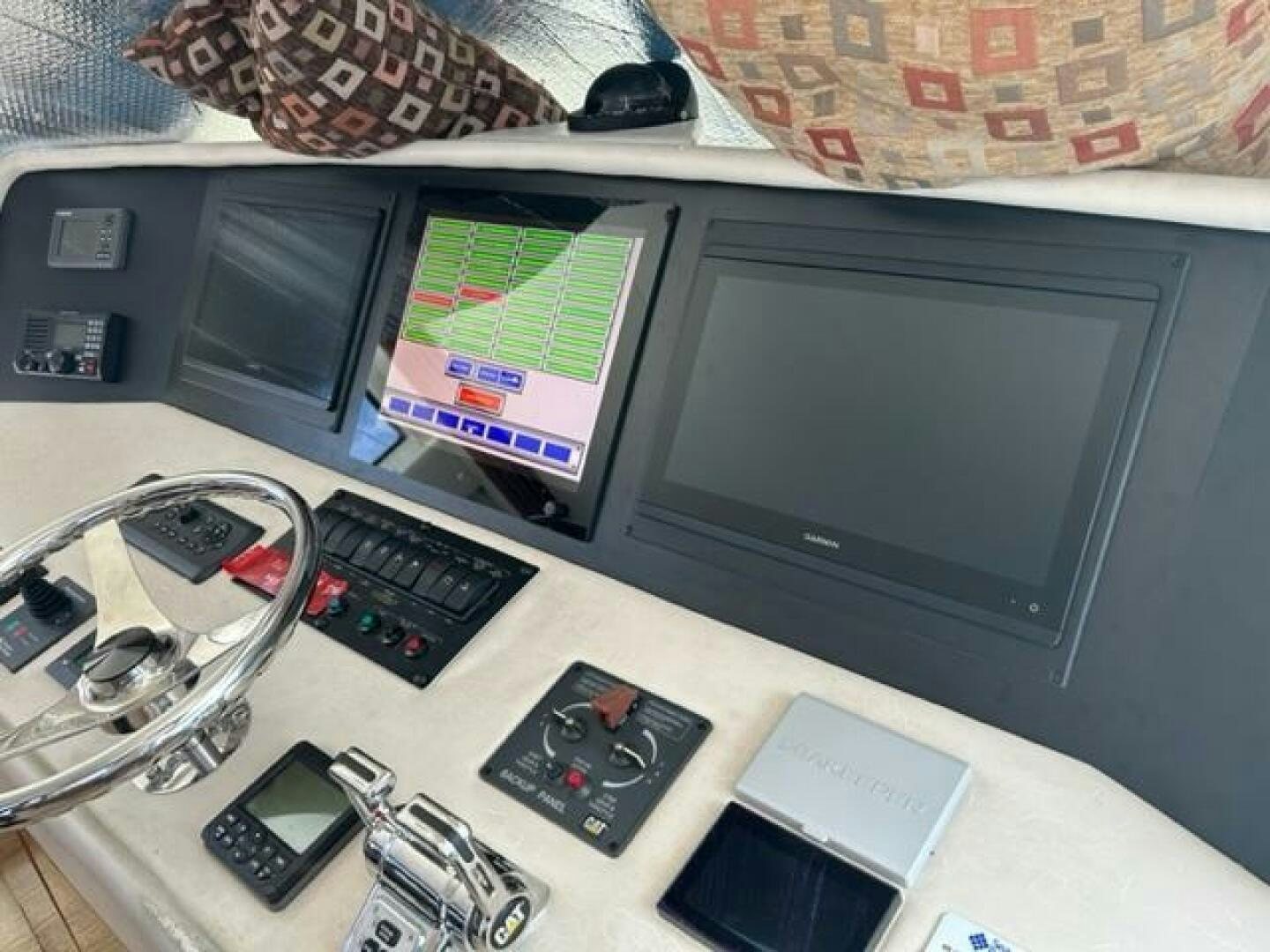a desk with a computer and electronics aboard LIVNWEL Yacht for Sale