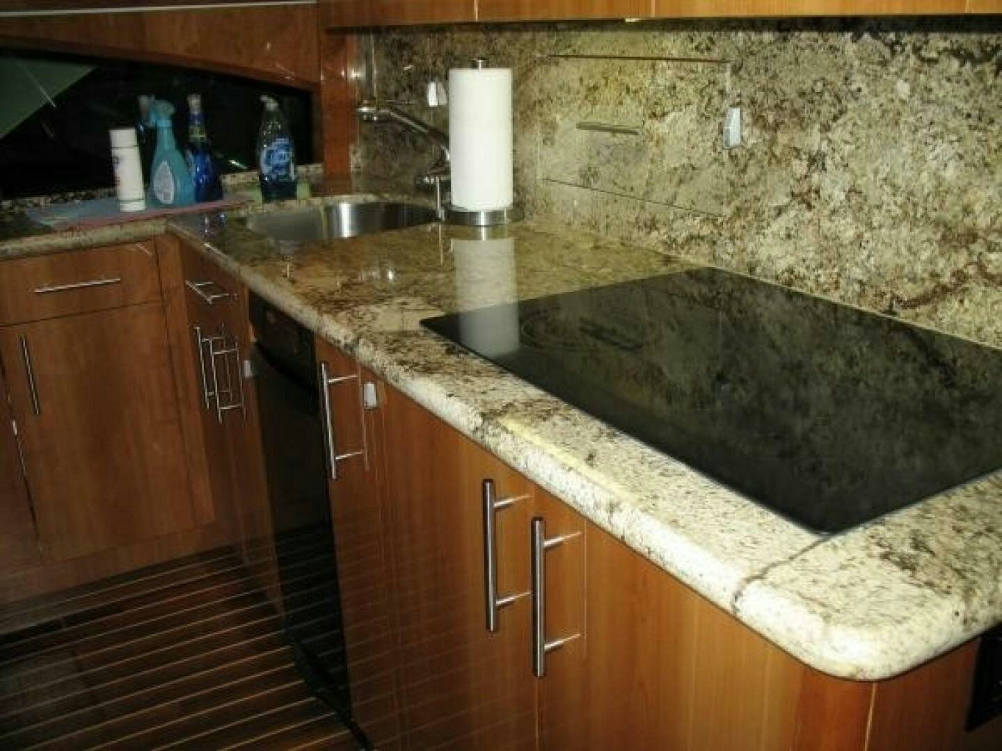 a kitchen with a sink and countertop aboard LIVNWEL Yacht for Sale
