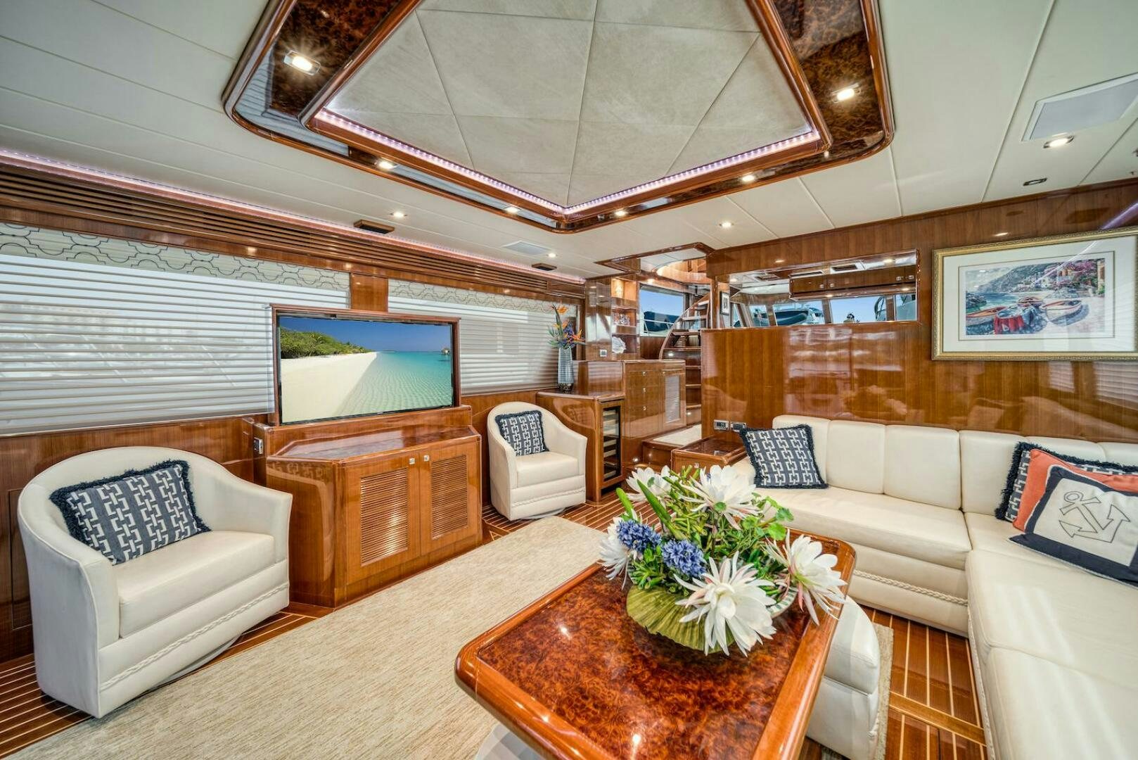 a living room with a table and chairs aboard ESCAPE Yacht for Sale