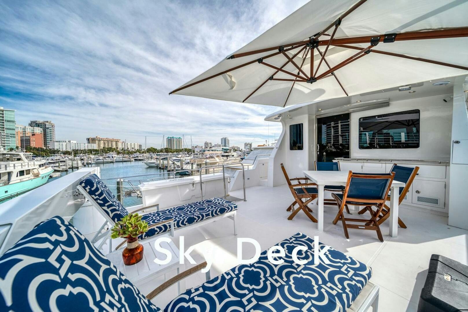 a large patio with a table and chairs on it aboard ESCAPE Yacht for Sale