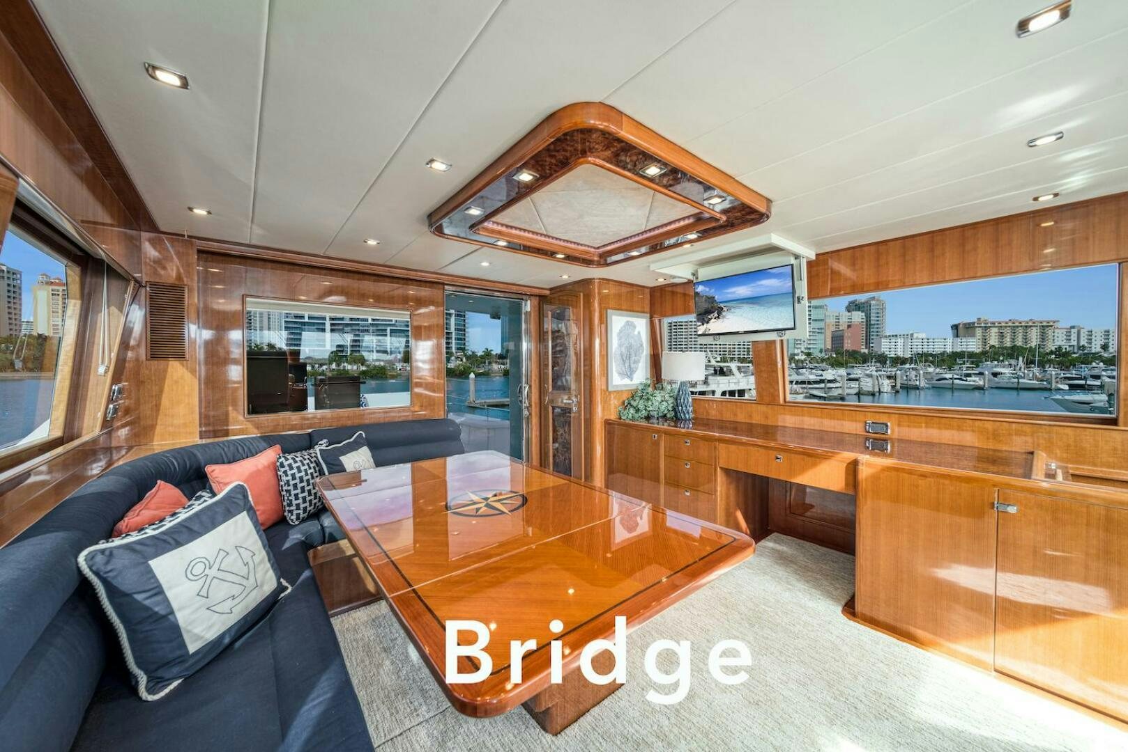 a living room with a large screen aboard ESCAPE Yacht for Sale