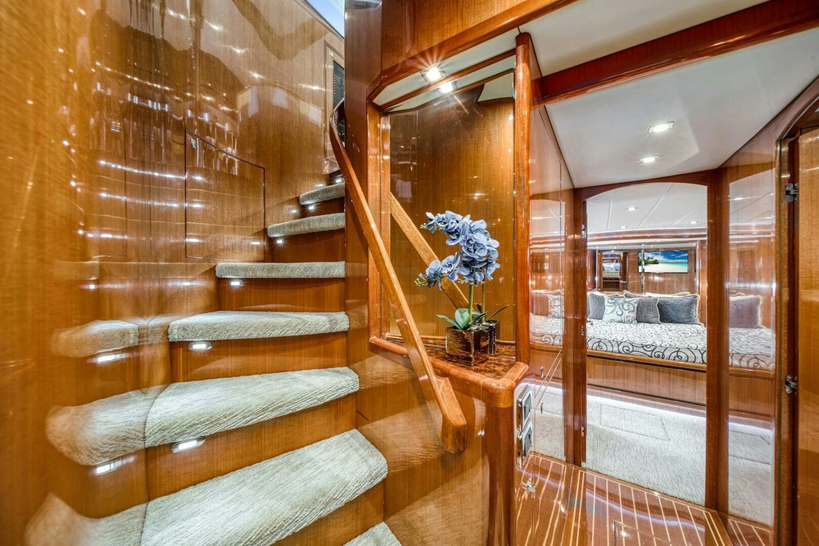 a room with a bed and a wood door aboard ESCAPE Yacht for Sale