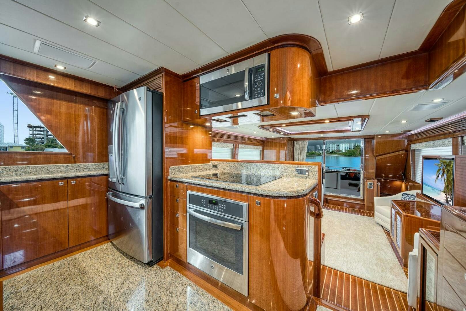 a kitchen with wooden cabinets aboard ESCAPE Yacht for Sale