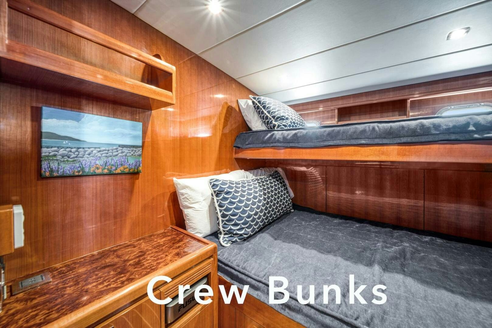 a bed with a wooden headboard aboard ESCAPE Yacht for Sale