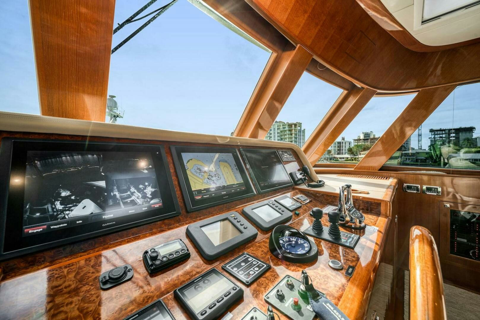 a table with cell phones and a television on it aboard ESCAPE Yacht for Sale