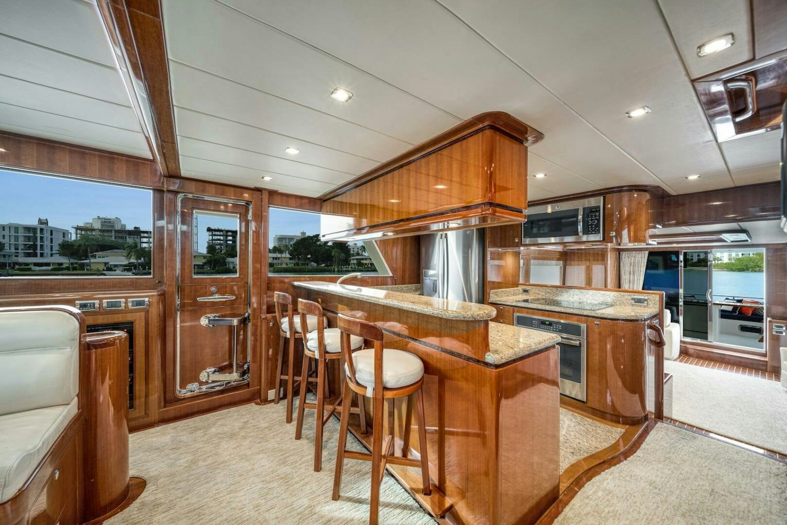 a kitchen with a table and chairs aboard ESCAPE Yacht for Sale