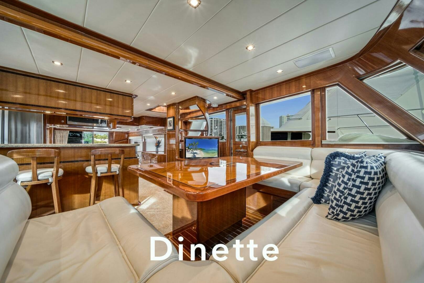 a room with a table and couches aboard ESCAPE Yacht for Sale