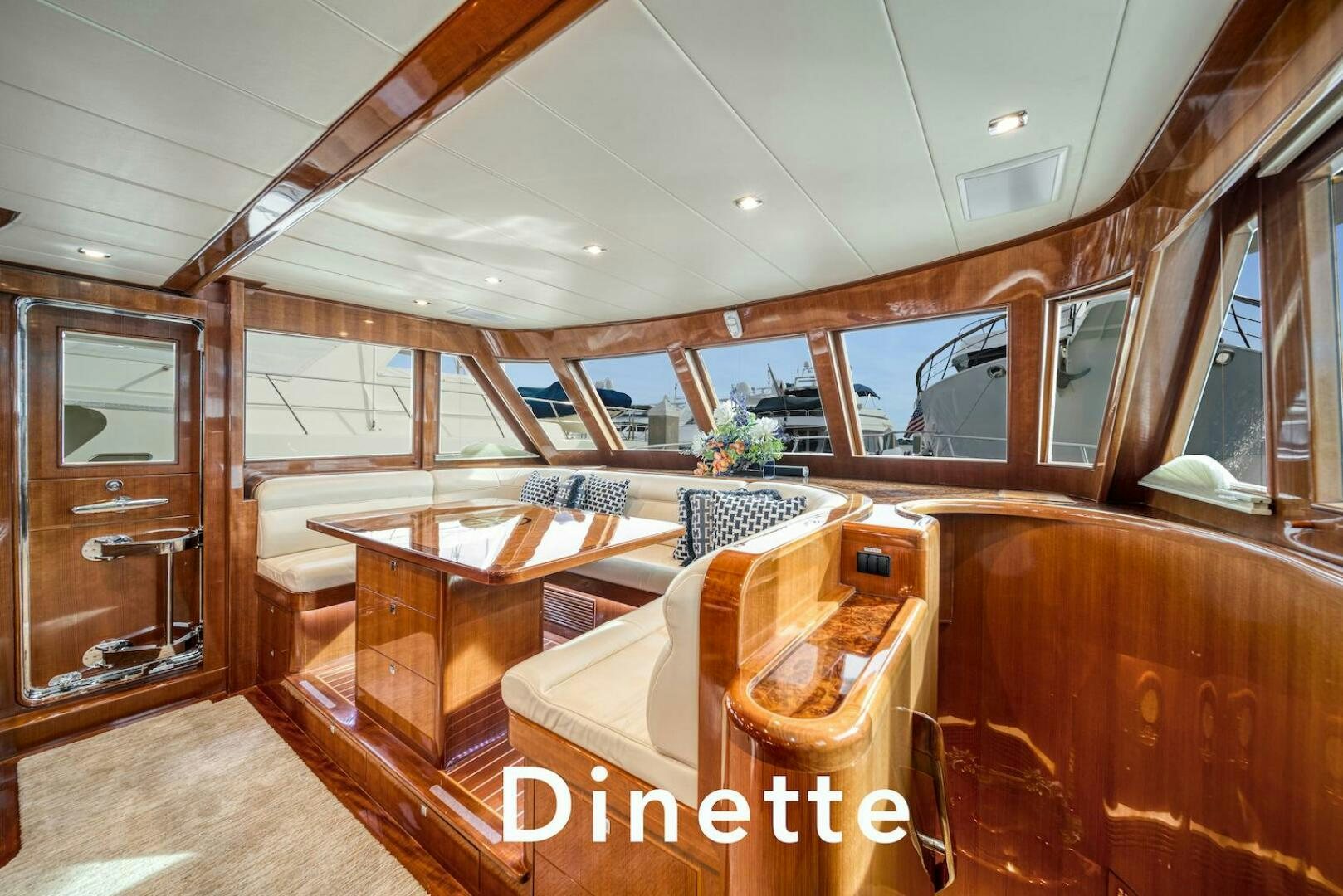 a room with wooden furniture aboard ESCAPE Yacht for Sale