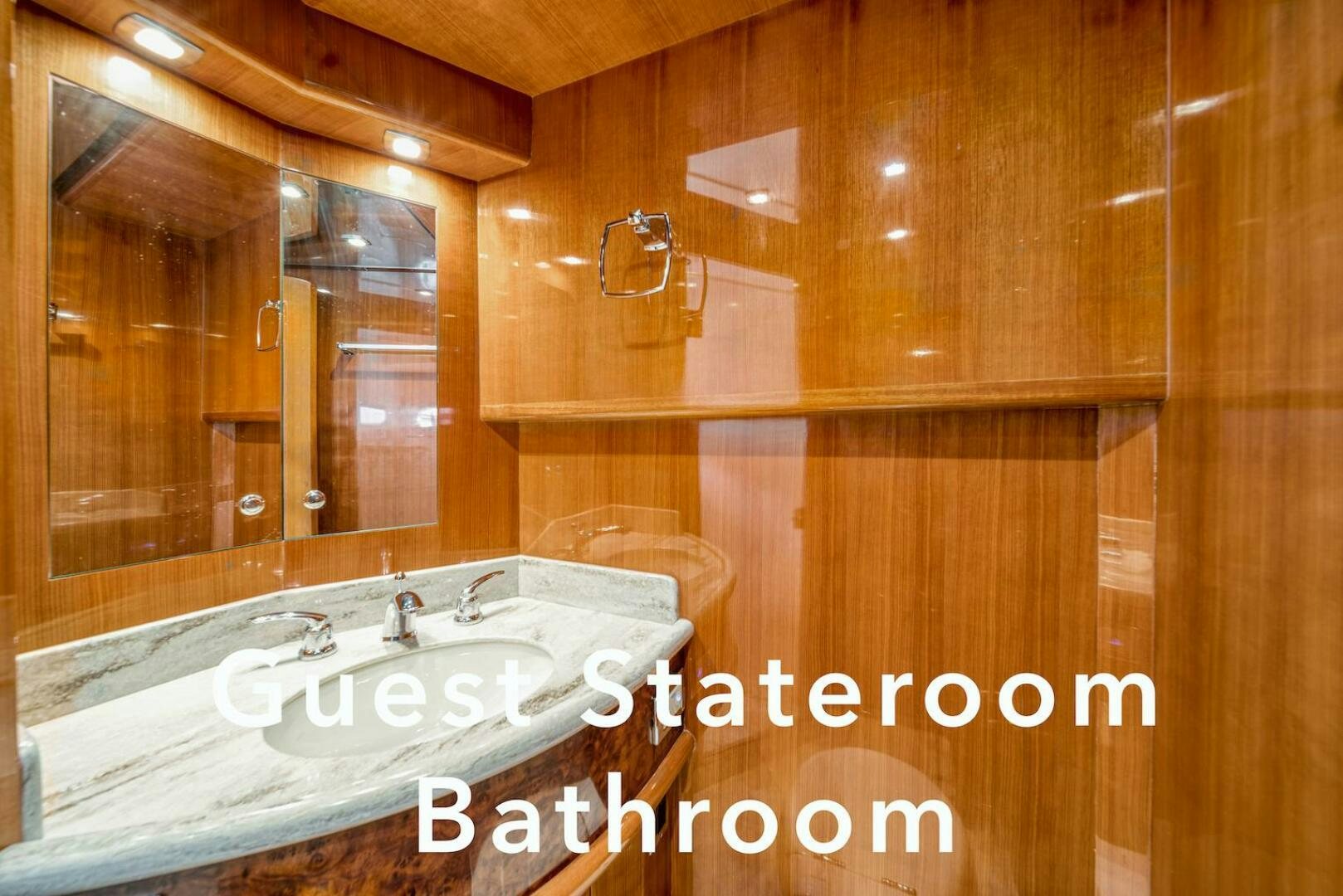 a bathroom with wooden walls aboard ESCAPE Yacht for Sale