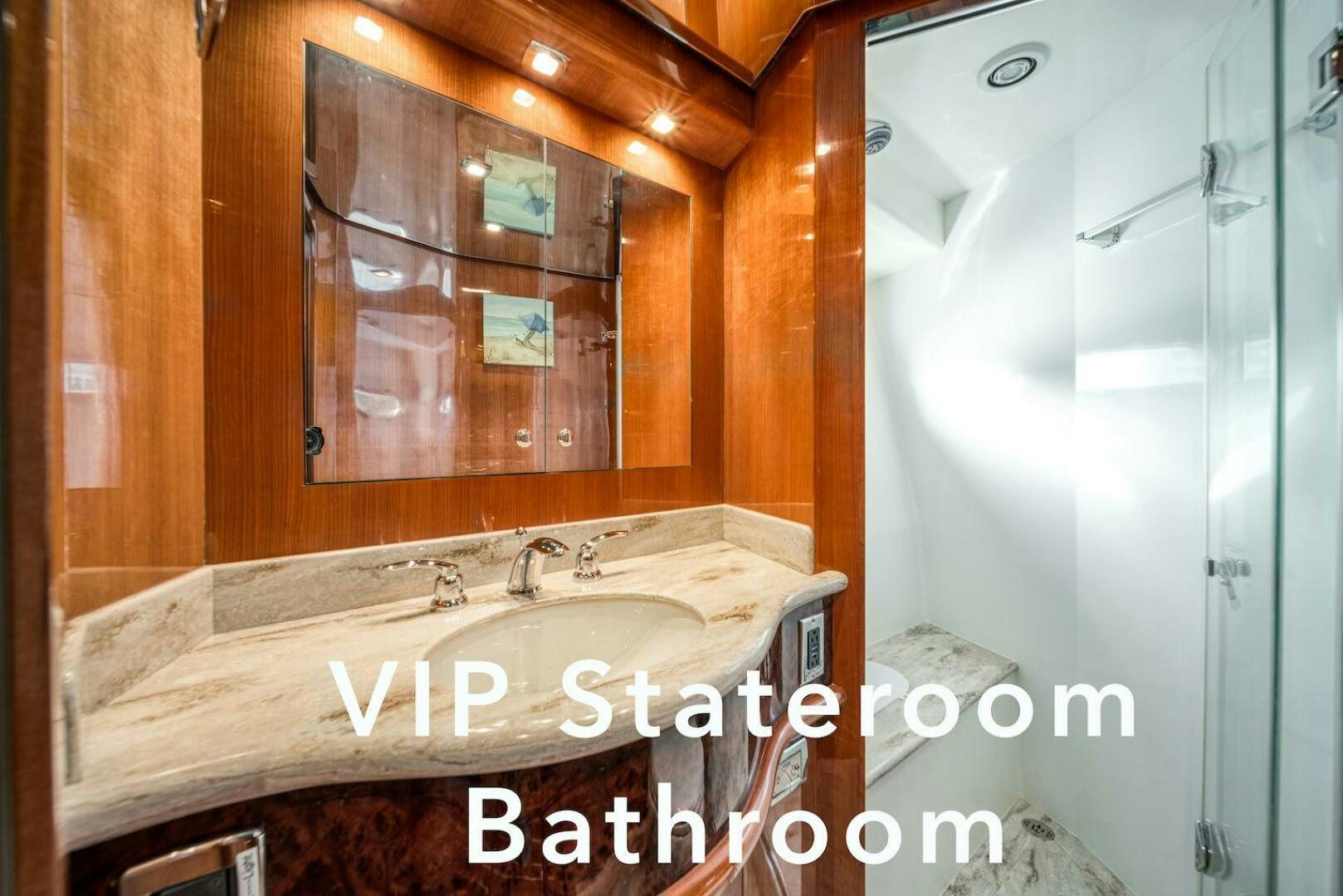 a bathroom with a sink and a mirror aboard ESCAPE Yacht for Sale