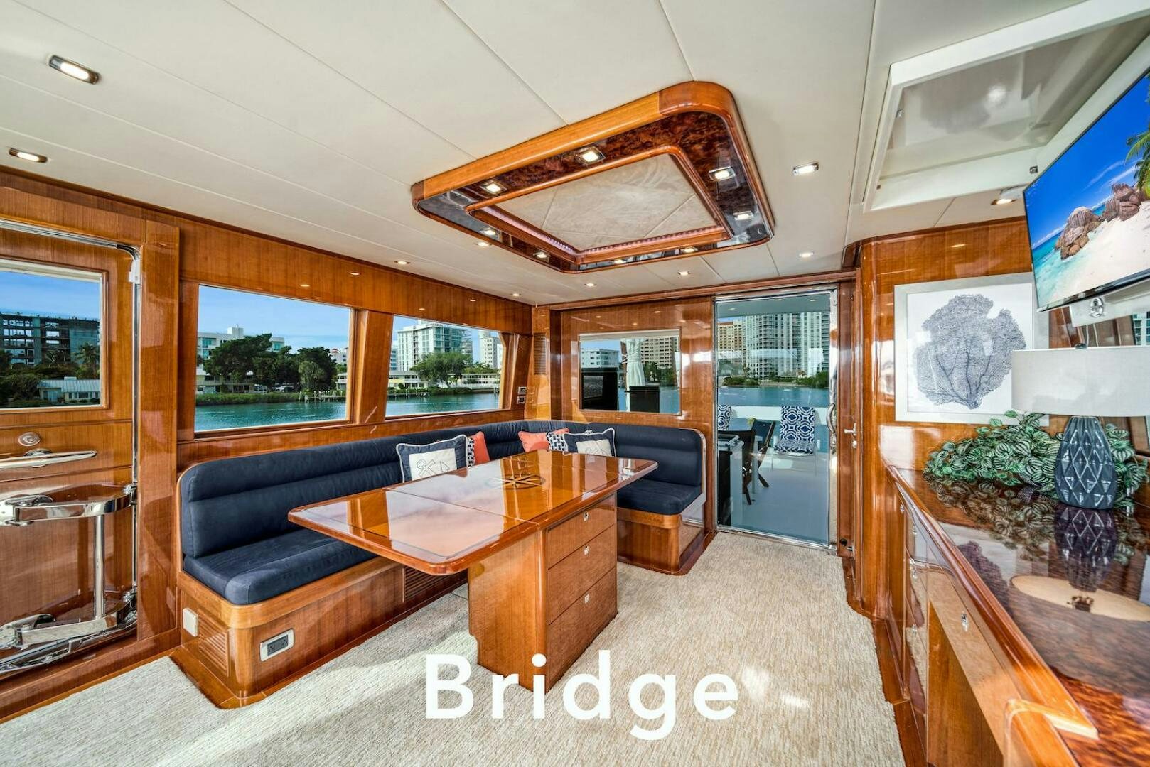 a living room with a leather couch aboard ESCAPE Yacht for Sale