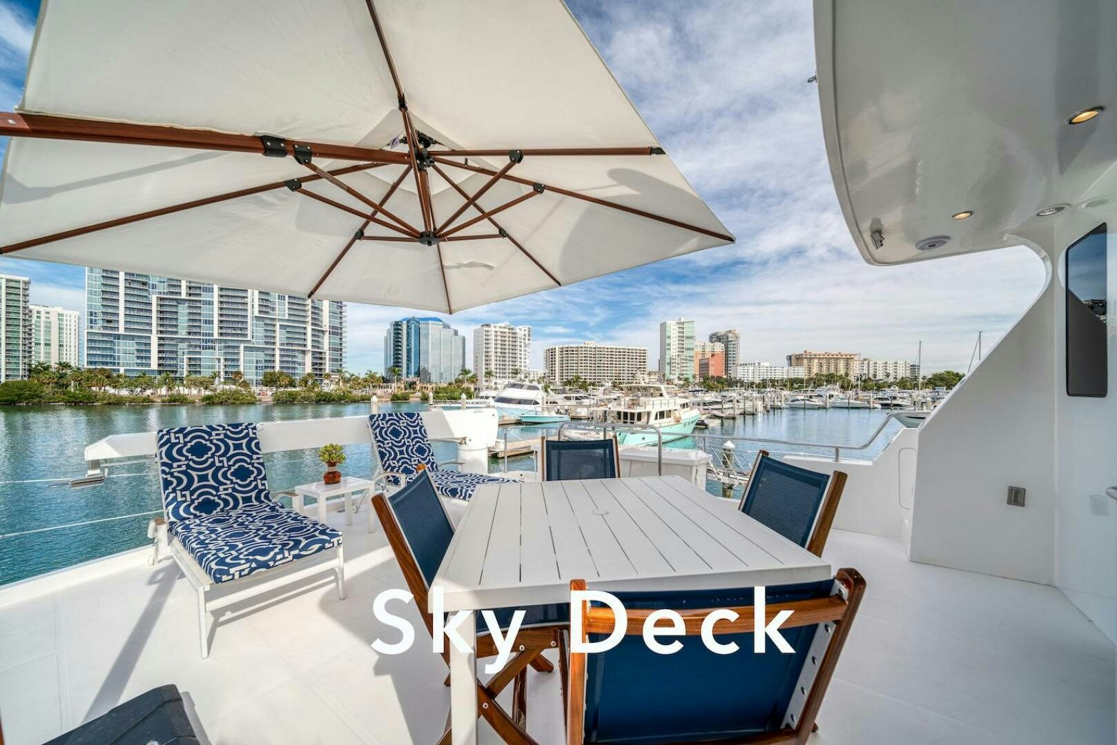 a table and chairs on a deck aboard ESCAPE Yacht for Sale