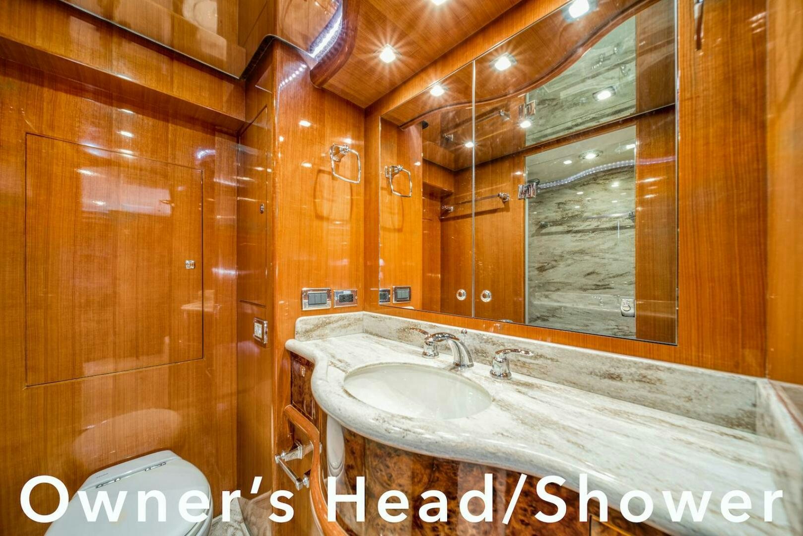 a bathroom with a sink and a mirror aboard ESCAPE Yacht for Sale