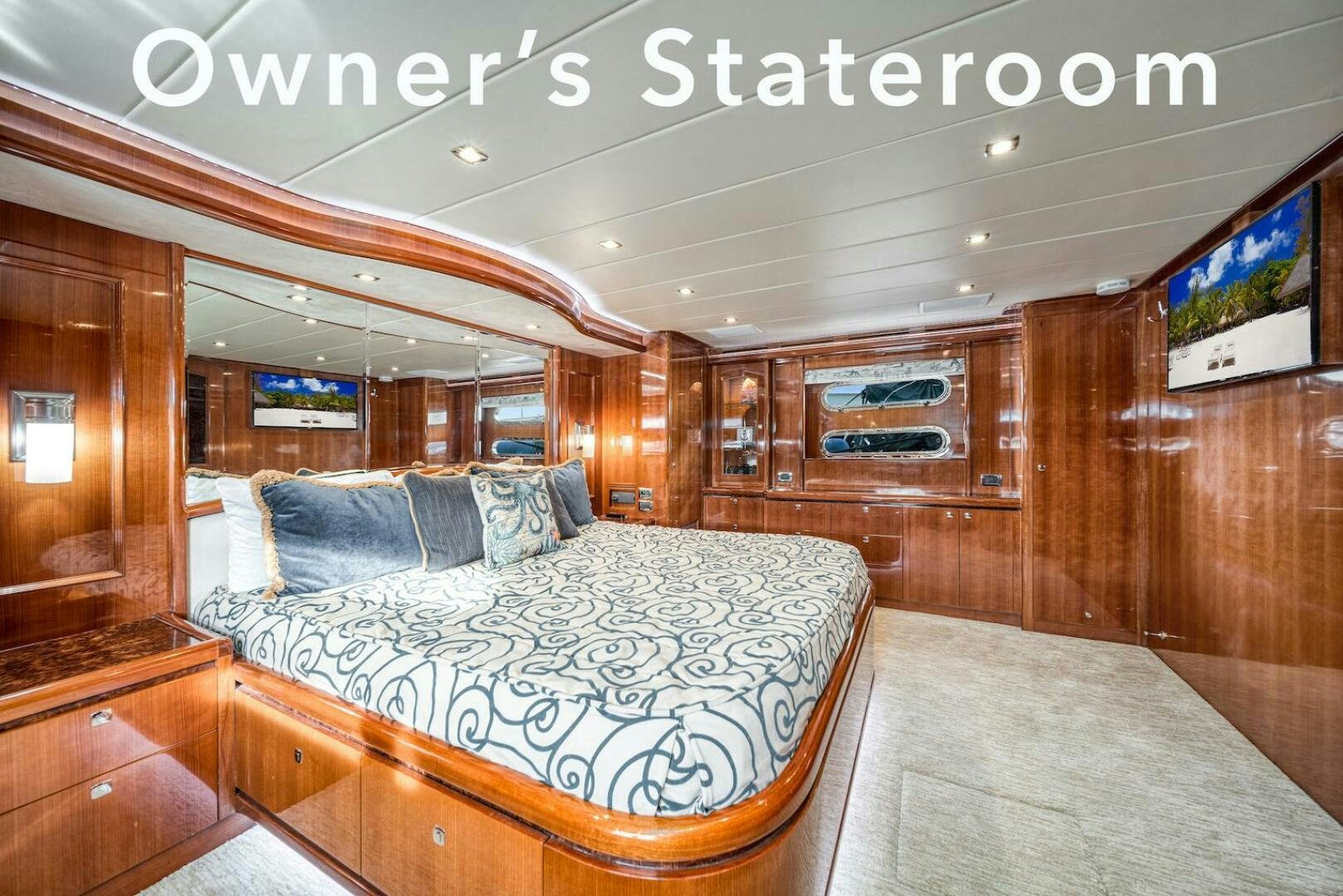 a room with a bed and a wood wall aboard ESCAPE Yacht for Sale