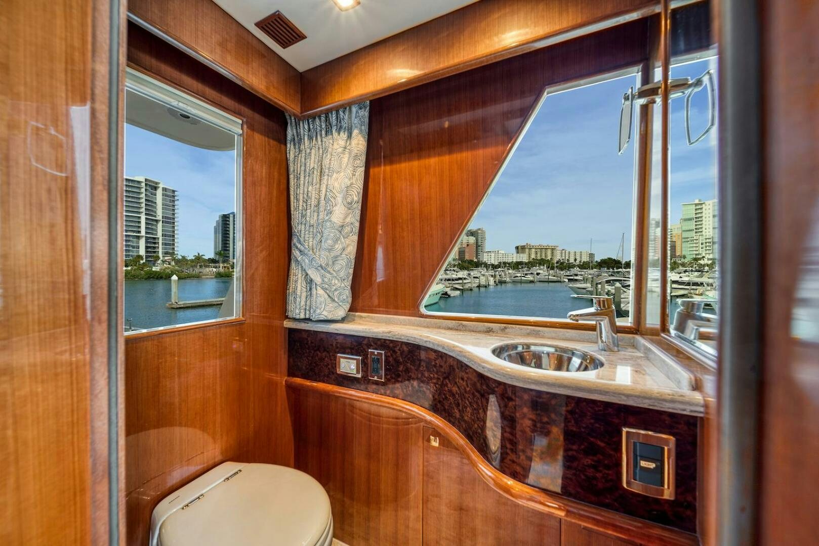a bathroom with a large window aboard ESCAPE Yacht for Sale