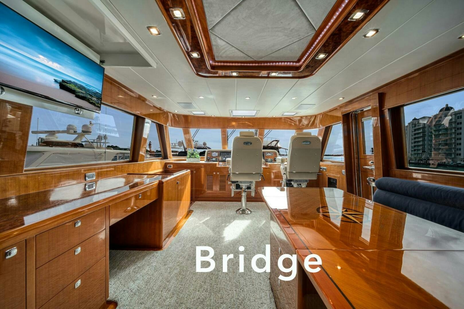 a room with a large desk and a large window aboard ESCAPE Yacht for Sale