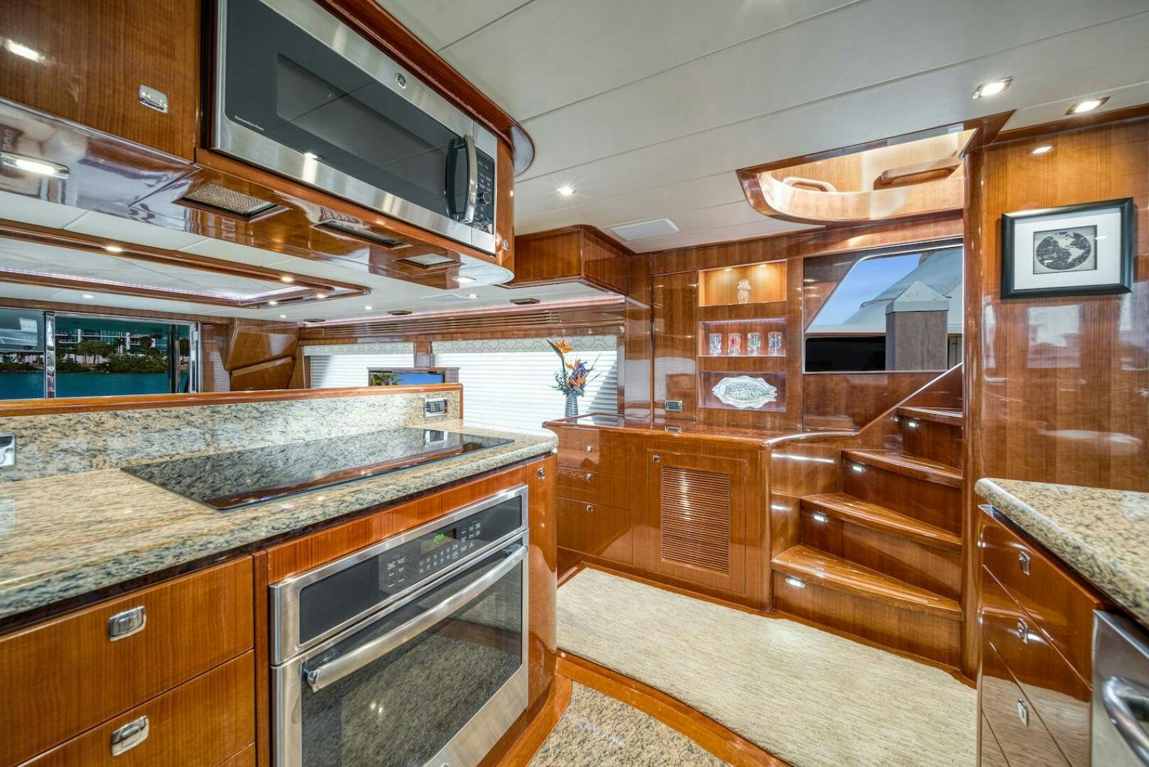 a kitchen with wooden cabinets aboard ESCAPE Yacht for Sale