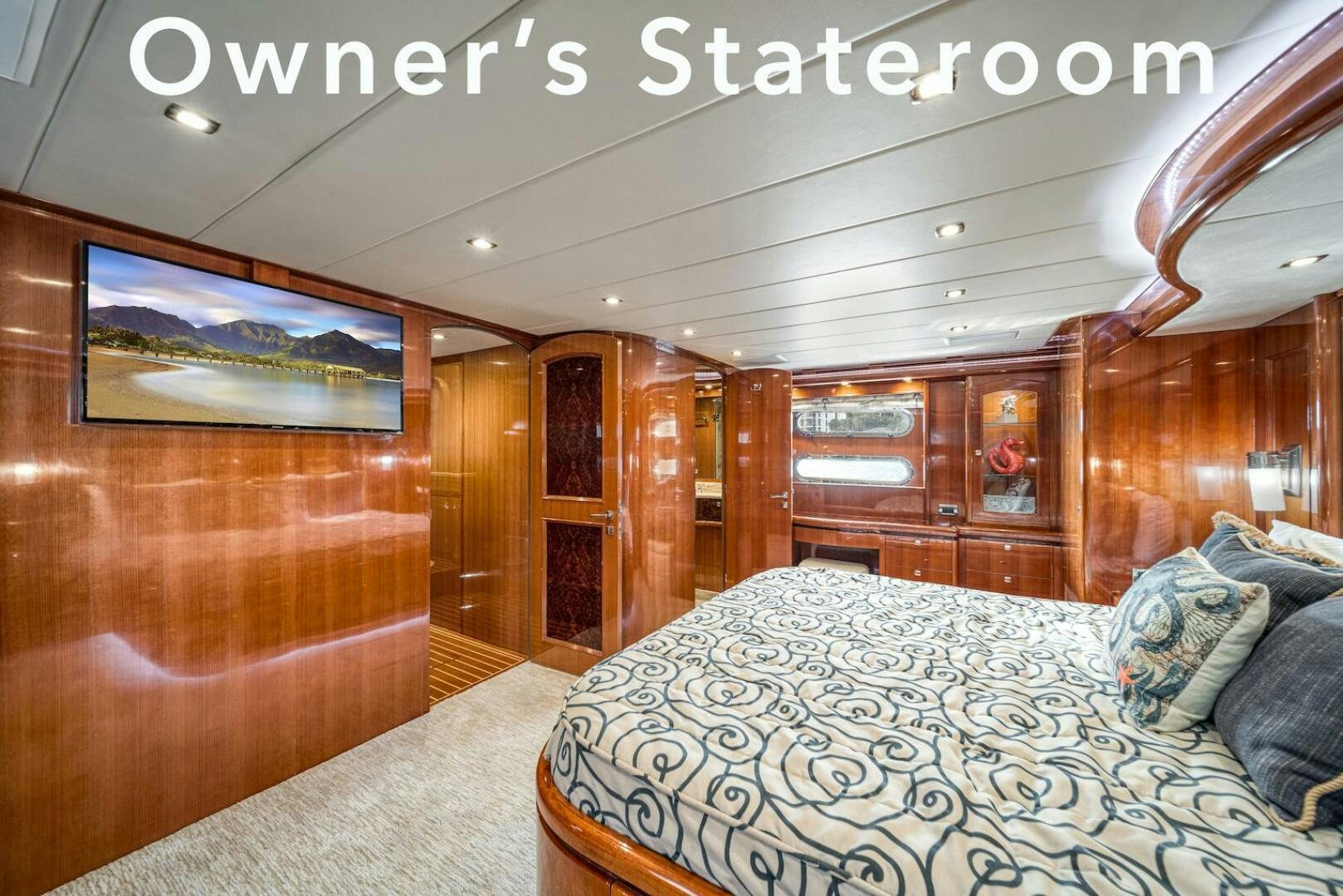 a room with a bed and a wood wall aboard ESCAPE Yacht for Sale