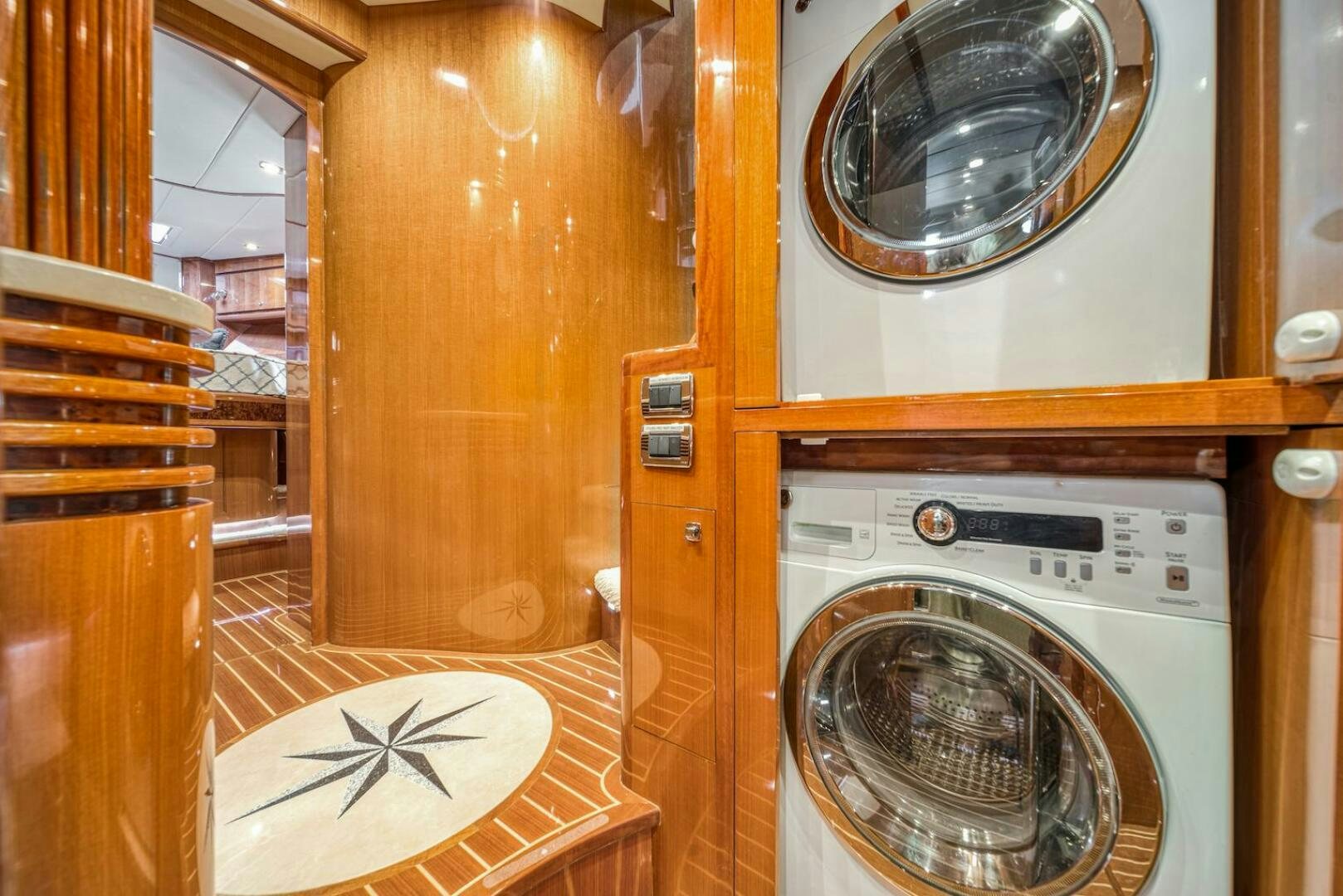 a room with a washing machine and dryer aboard ESCAPE Yacht for Sale
