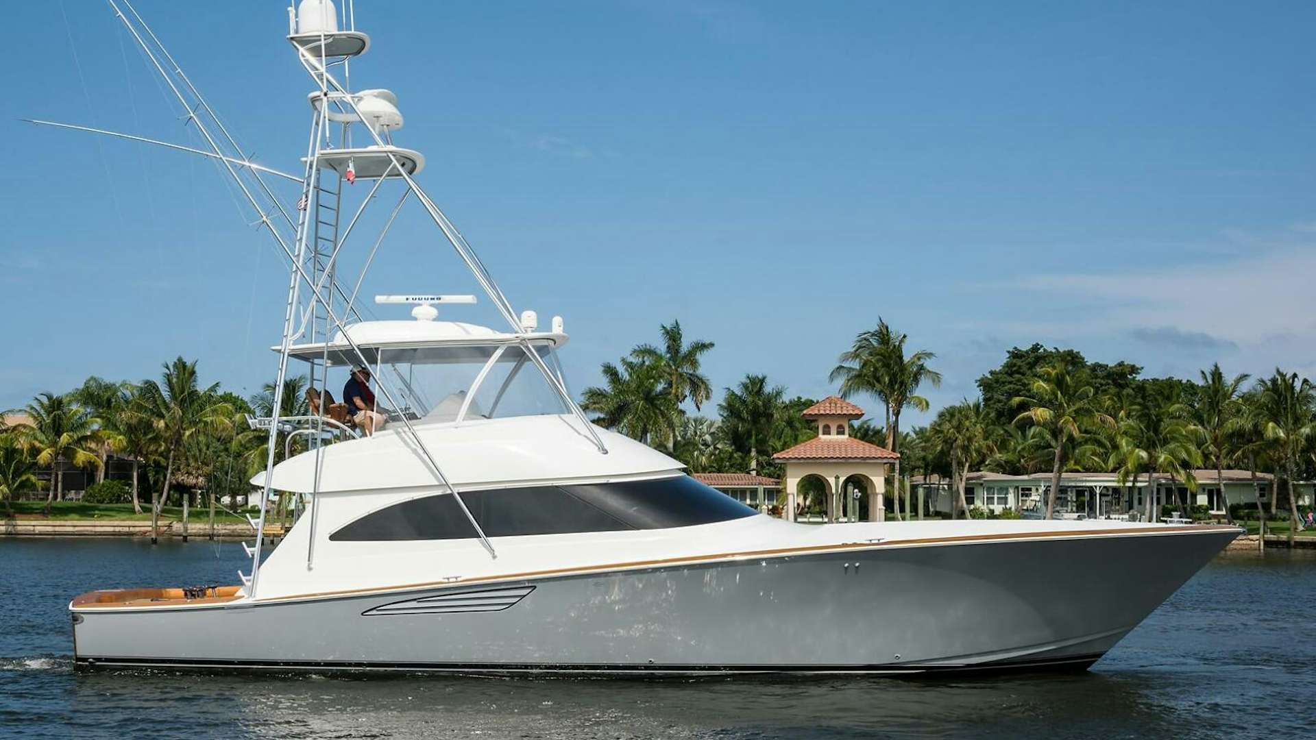 a white boat on the water aboard REEL DRAG Yacht for Sale