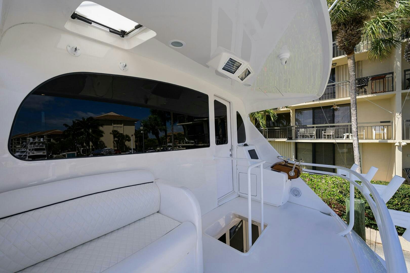 a white car with a large window aboard 80' VIKING Yacht for Sale