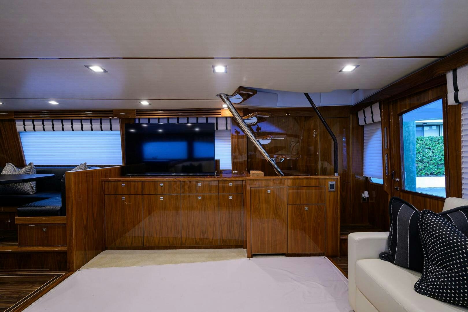 a room with a bed and a tv aboard 80' VIKING Yacht for Sale
