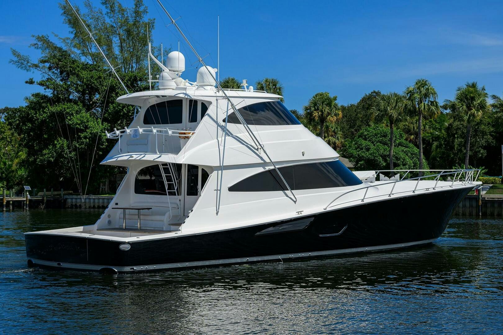 a white boat on the water aboard 80' VIKING Yacht for Sale