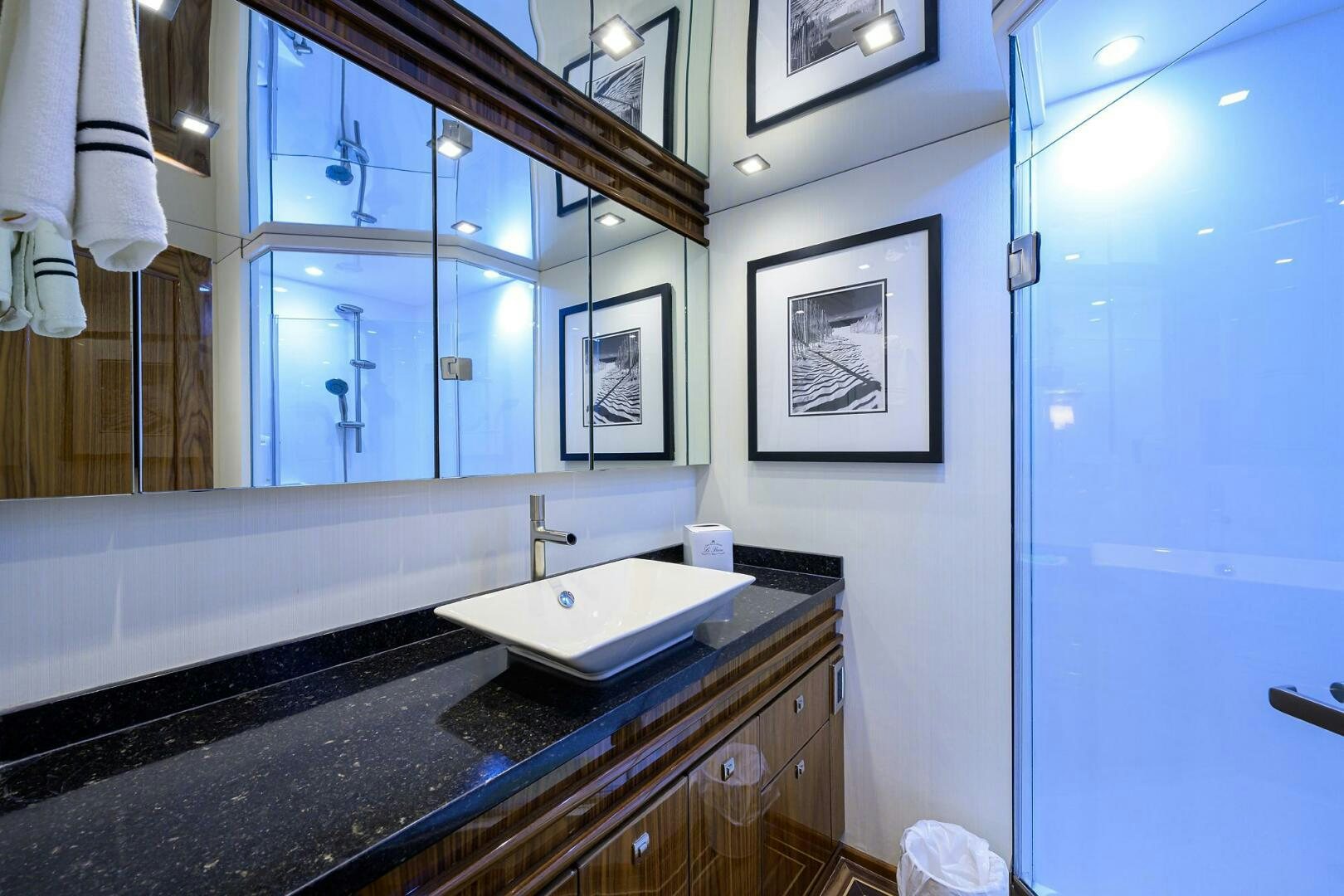 a bathroom with a sink and a mirror aboard 80' VIKING Yacht for Sale