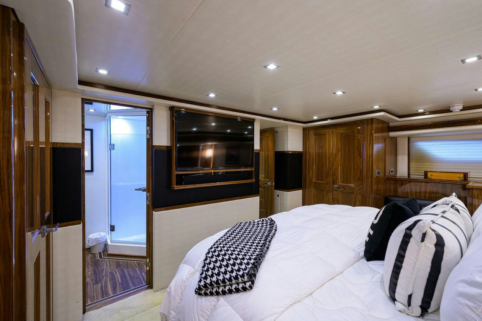 a bedroom with a large bed aboard 80' VIKING Yacht for Sale