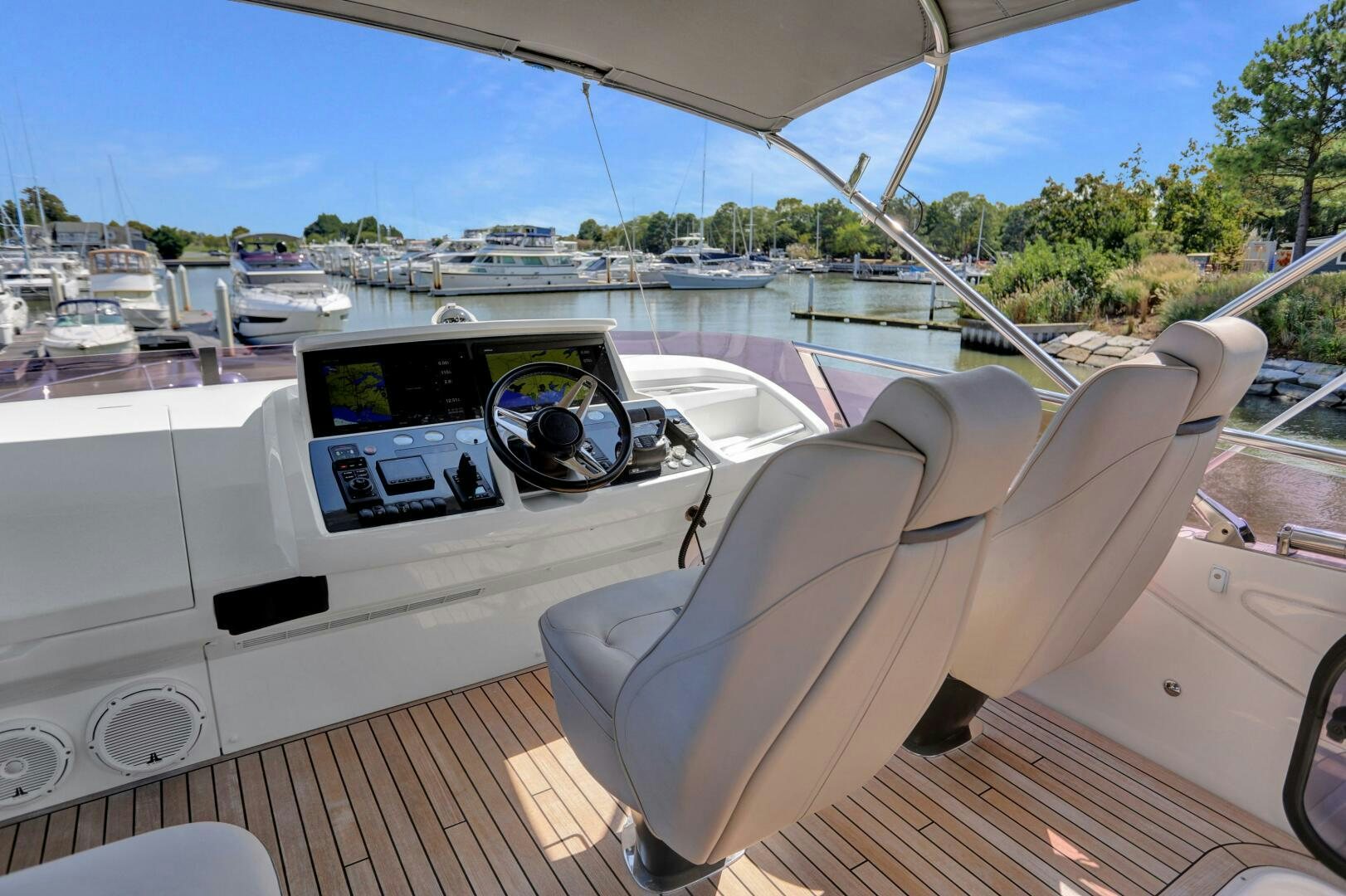 a boat with a seat on the deck aboard REAL SLICK Yacht for Sale