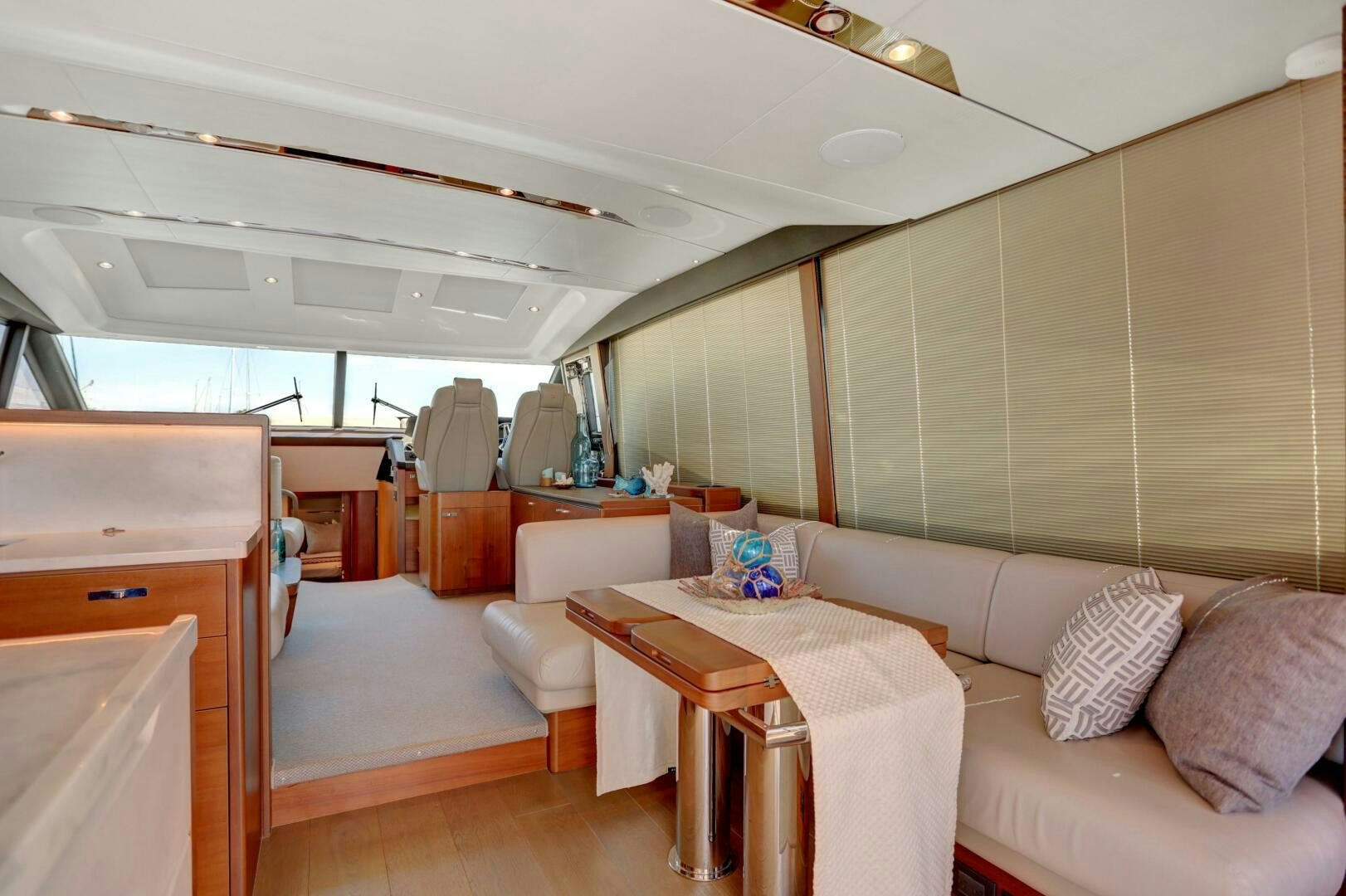 a room with a couch and a table aboard REAL SLICK Yacht for Sale