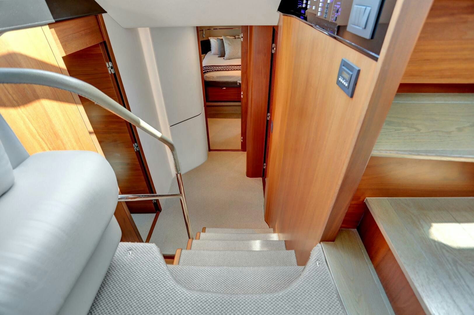 a room with a bed and a desk aboard REAL SLICK Yacht for Sale