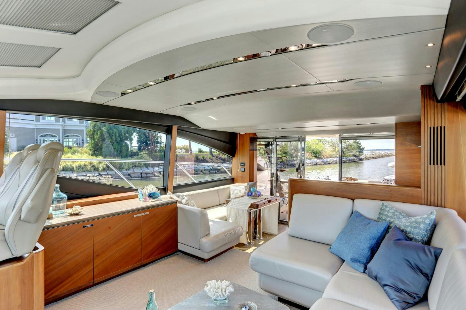a living room with a large window aboard REAL SLICK Yacht for Sale