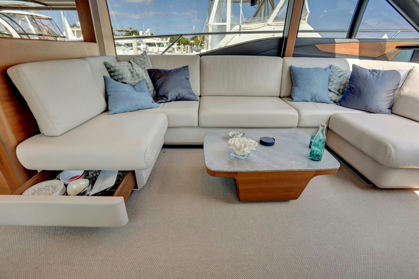 a couch with a coffee table aboard REAL SLICK Yacht for Sale