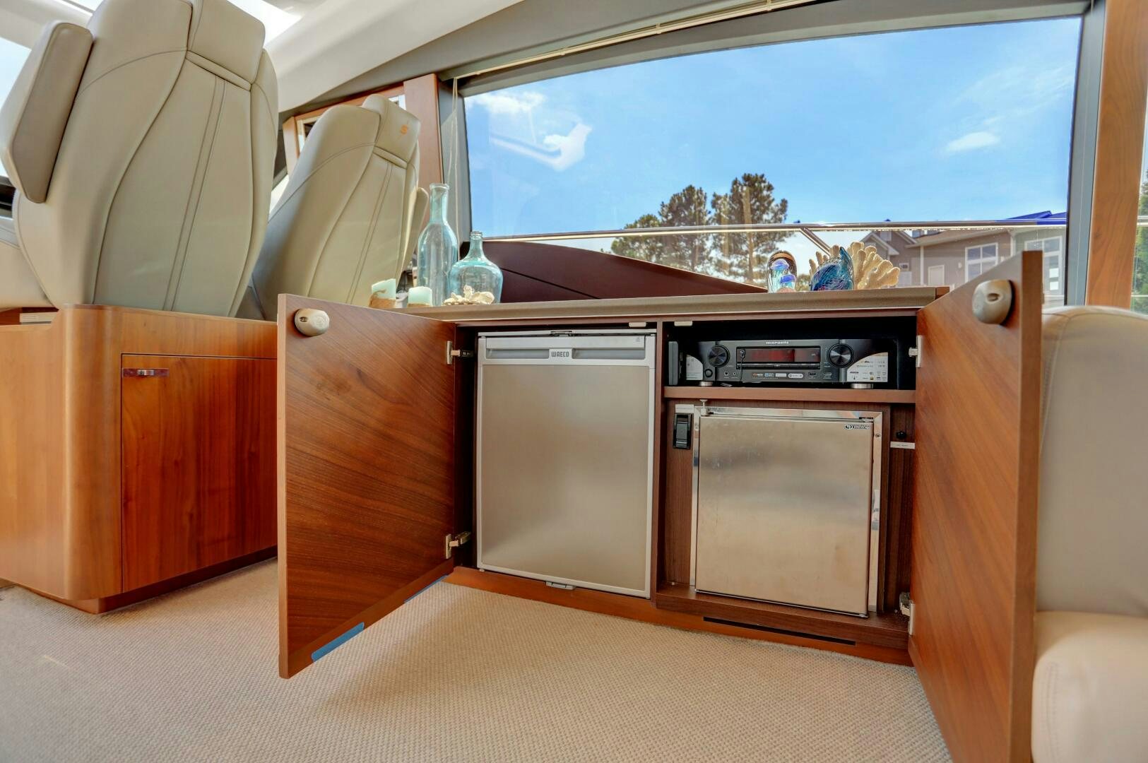 a room with a window and a couch aboard REAL SLICK Yacht for Sale