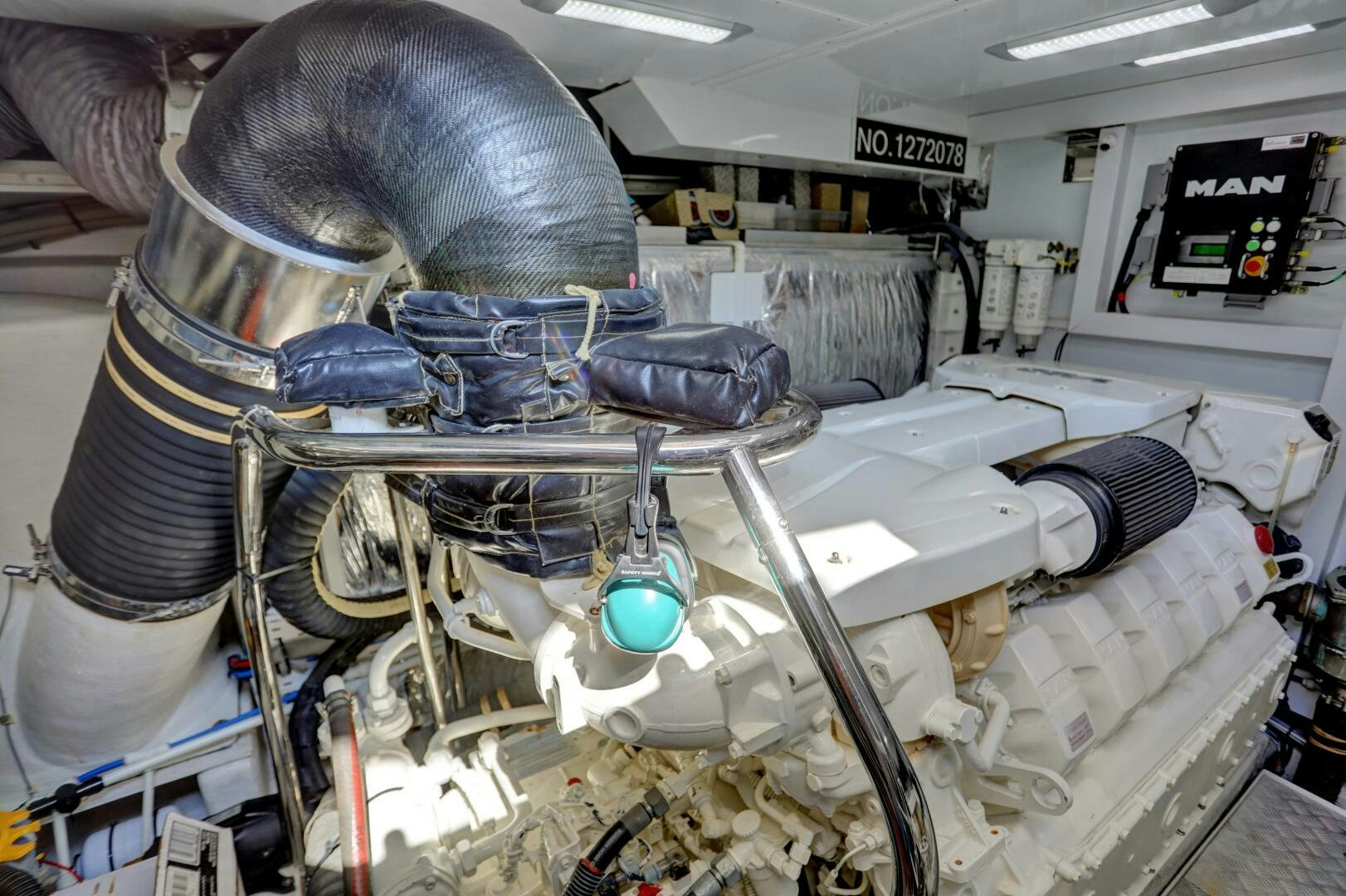 a large machine with a large metal cylinder aboard REAL SLICK Yacht for Sale