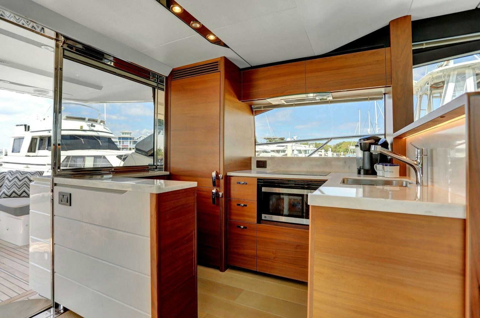 a kitchen with a glass door aboard REAL SLICK Yacht for Sale