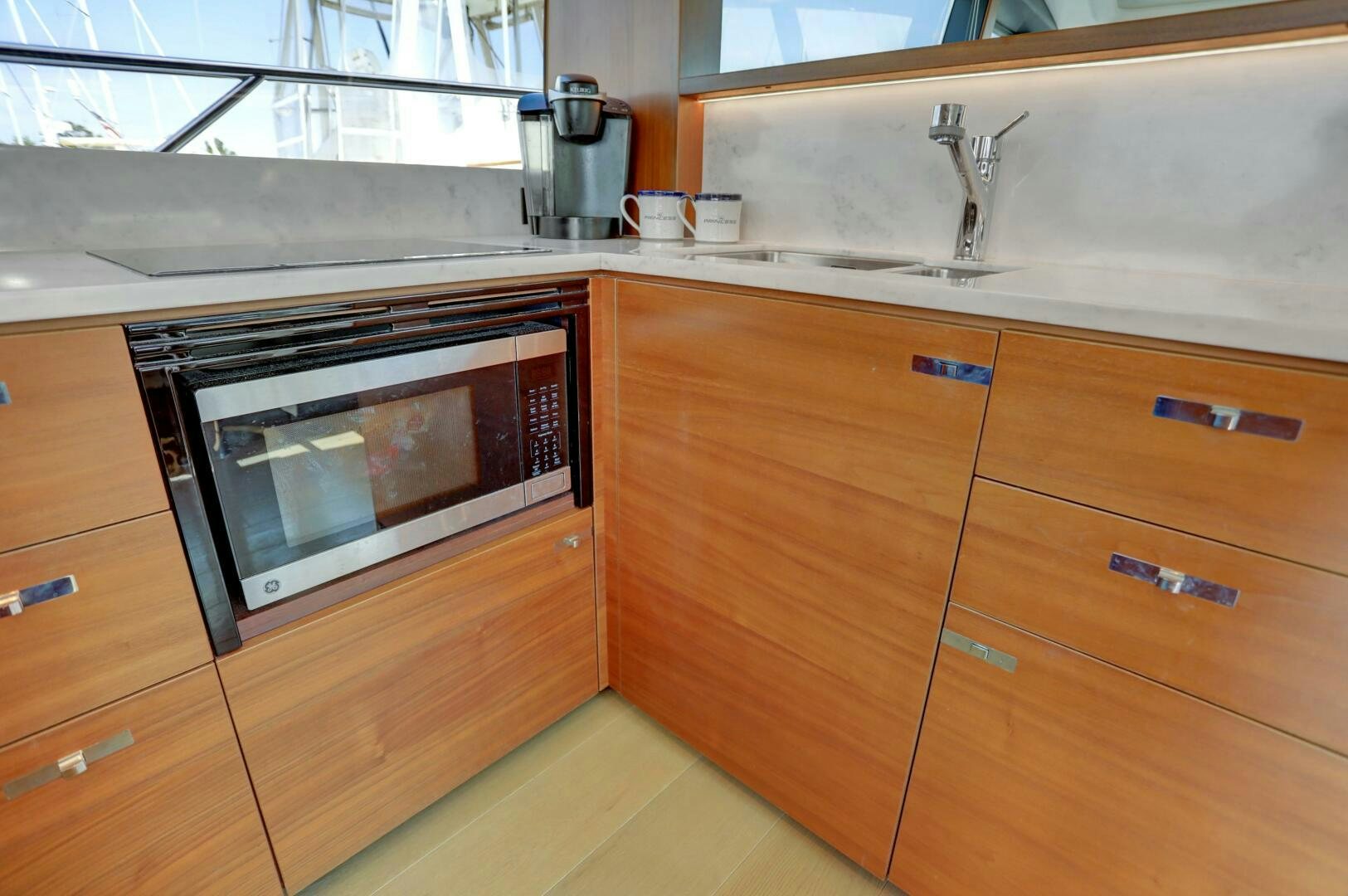 a kitchen with a microwave oven aboard REAL SLICK Yacht for Sale
