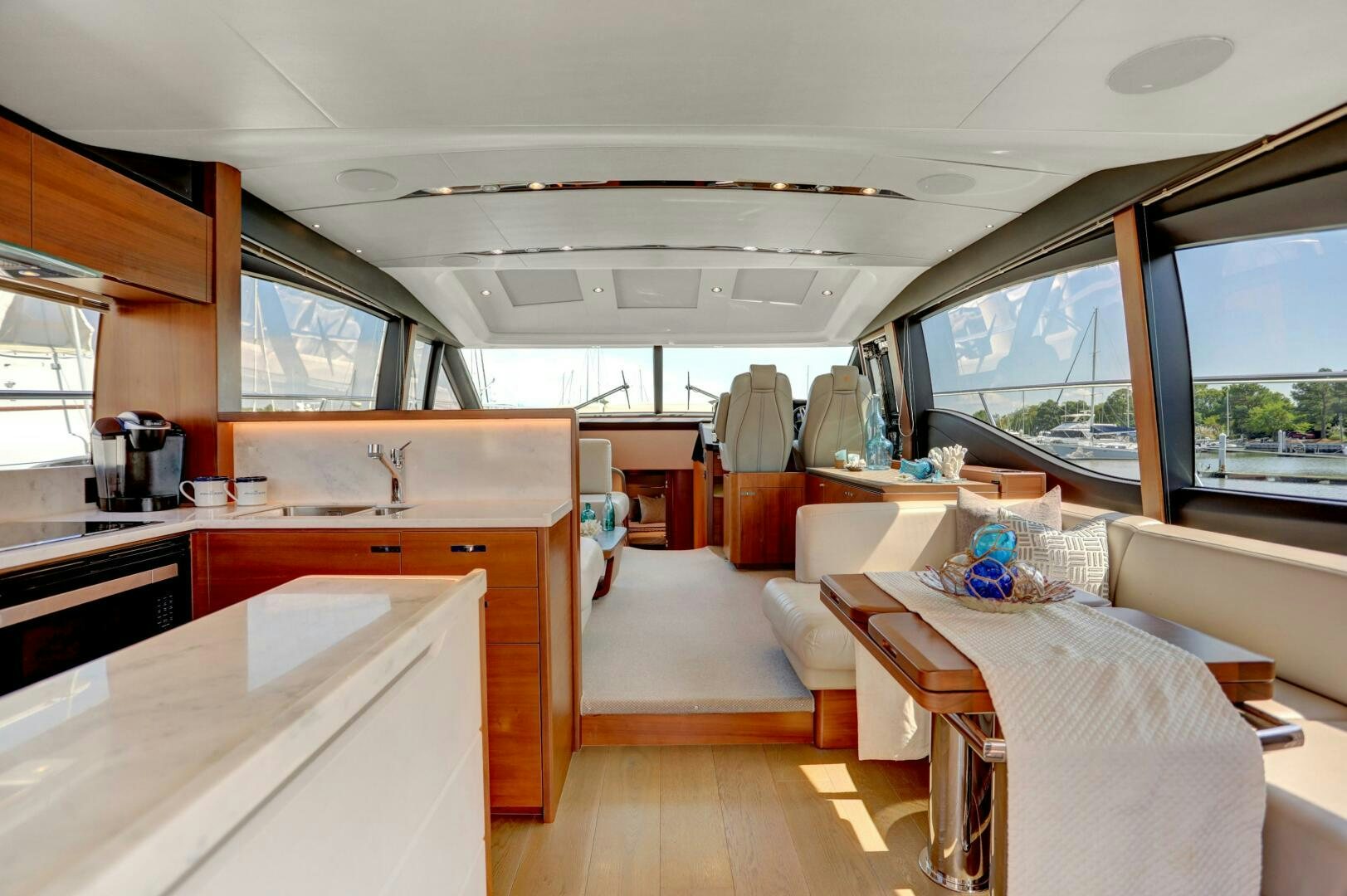 a large kitchen with a large window aboard REAL SLICK Yacht for Sale